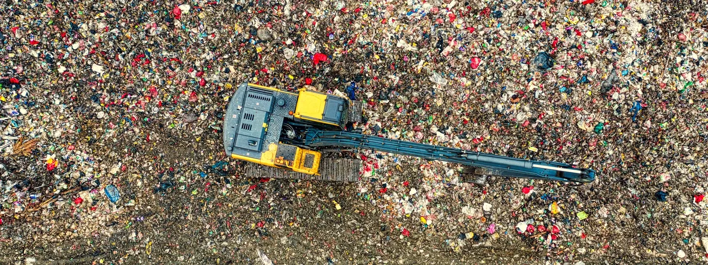Mixed construction and demolition waste being worked at the transfer station