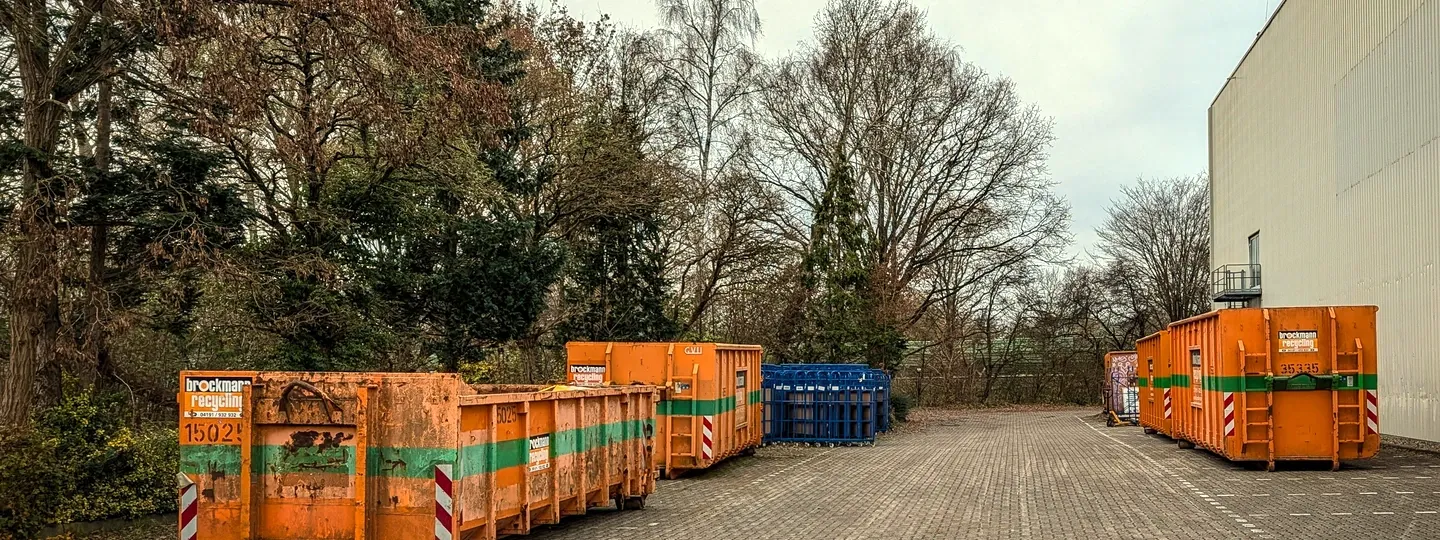Waste containers standing at an industrial yard
